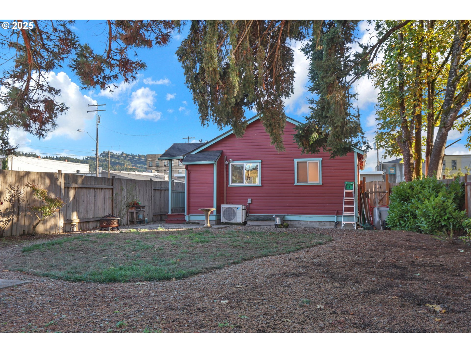 728 East Whiteaker Avenue Cottage Grove, OR 97424 - Photo 22 of 38 a view of a yard in front of a house with large tree