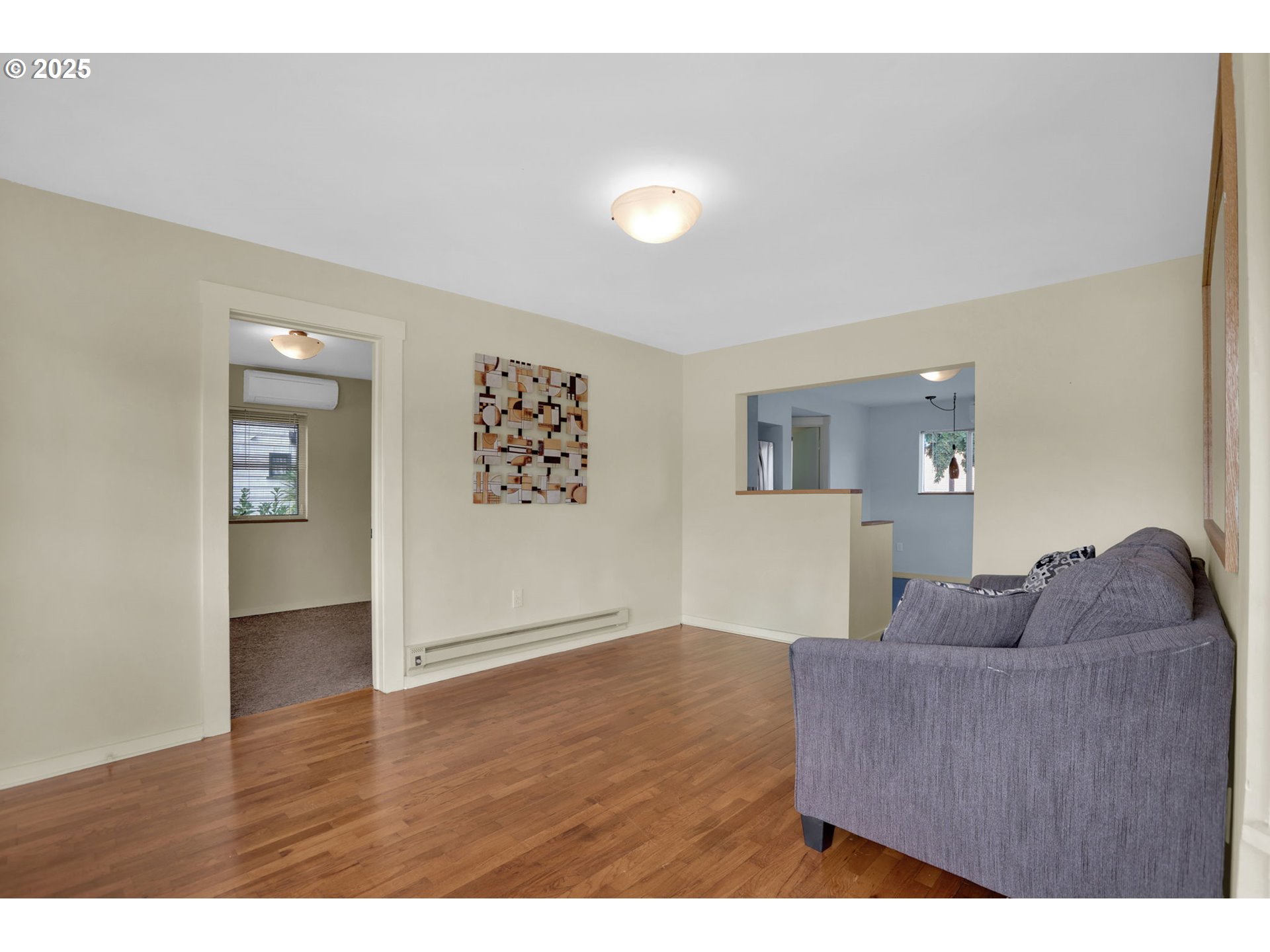 728 East Whiteaker Avenue Cottage Grove, OR 97424 - Photo 10 of 38 a living room with furniture and a wooden floor