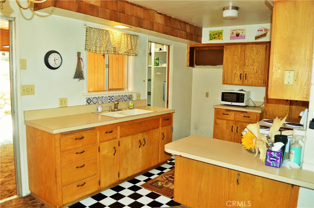 53337 Tollgate Road Idyllwild, CA 92549 - Photo 3 of 30 a utility room with a sink a washer and dryer