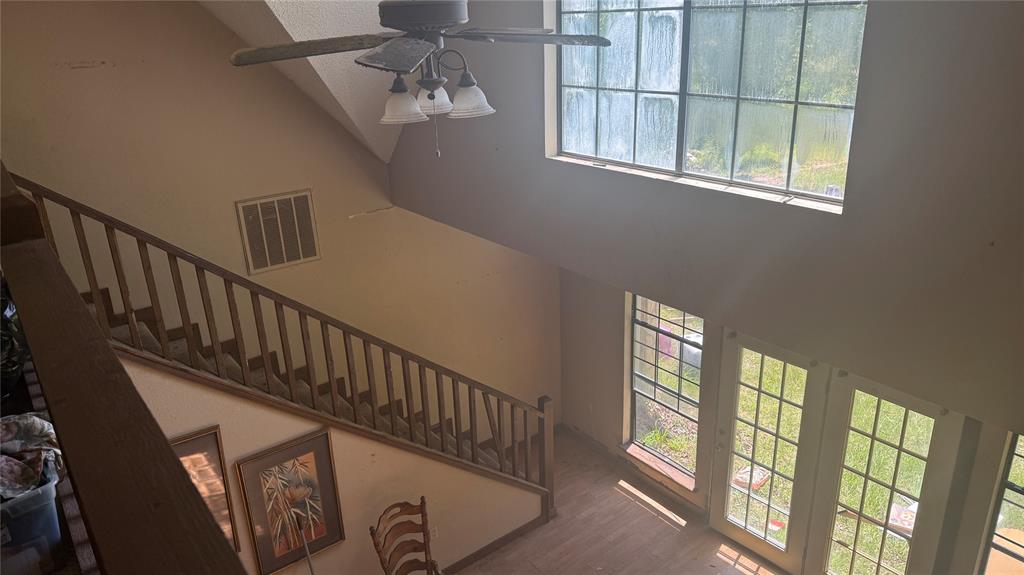 6582 Taylor Road Kaufman, TX 75142 - Photo 10 of 40 a view of entryway with stairs and wooden floor