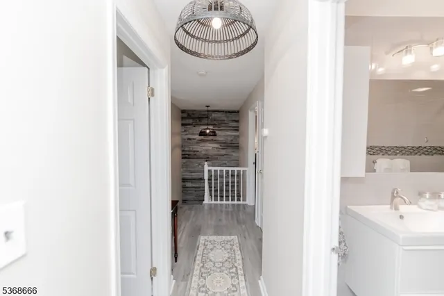 a view of a hallway with washer and dryer