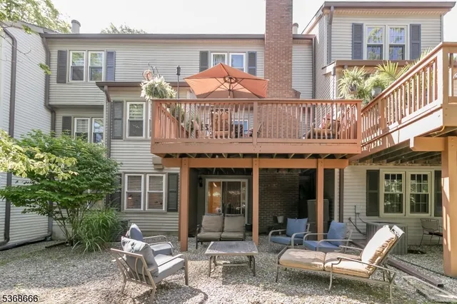 a front view of a building with outdoor seating