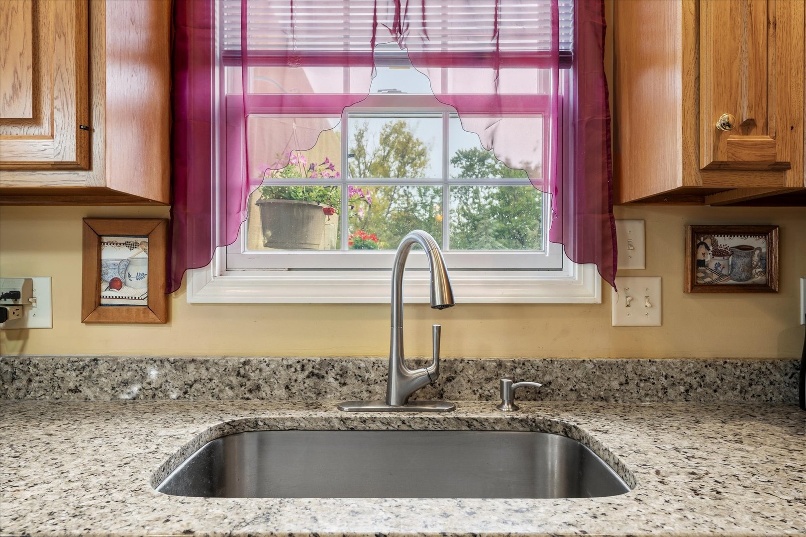 1706 Tin Cup Road, Unit 1706 Mahomet, IL 61853 - Photo 18 of 43 a kitchen with a sink a counter top space and cabinets