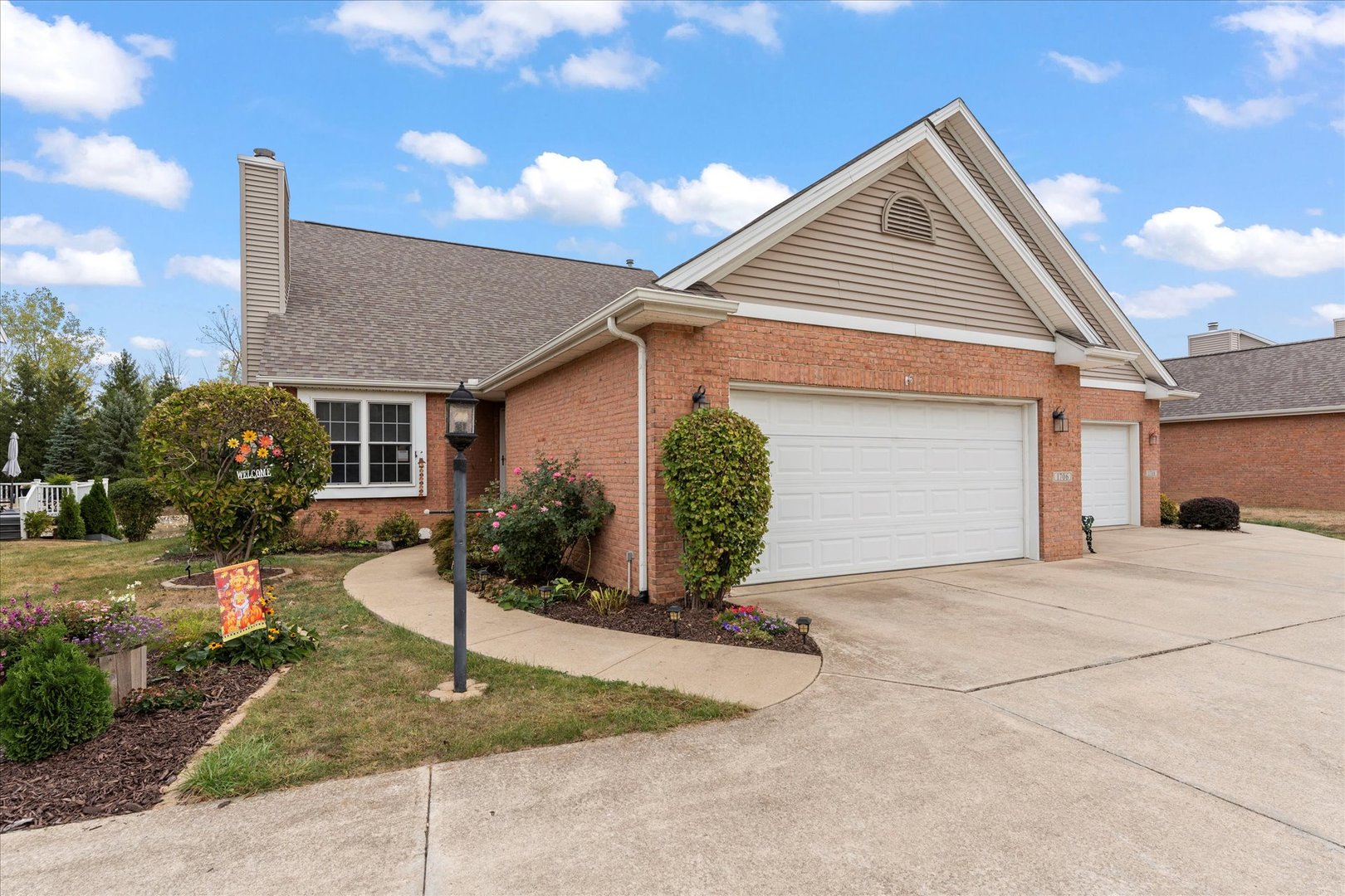 1706 Tin Cup Road, Unit 1706 Mahomet, IL 61853 - Photo 2 of 43 a view of a house with a patio