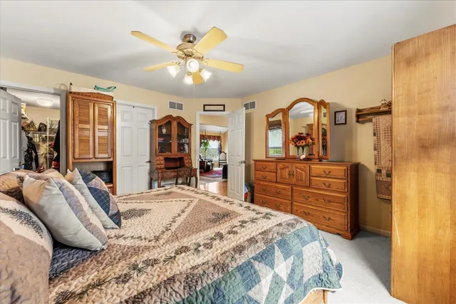 a bed room with a bed and a dresser