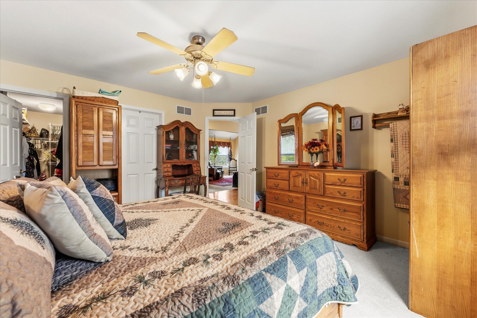 1706 Tin Cup Road, Unit 1706 Mahomet, IL 61853 - Photo 22 of 43 a bed room with a bed and a dresser