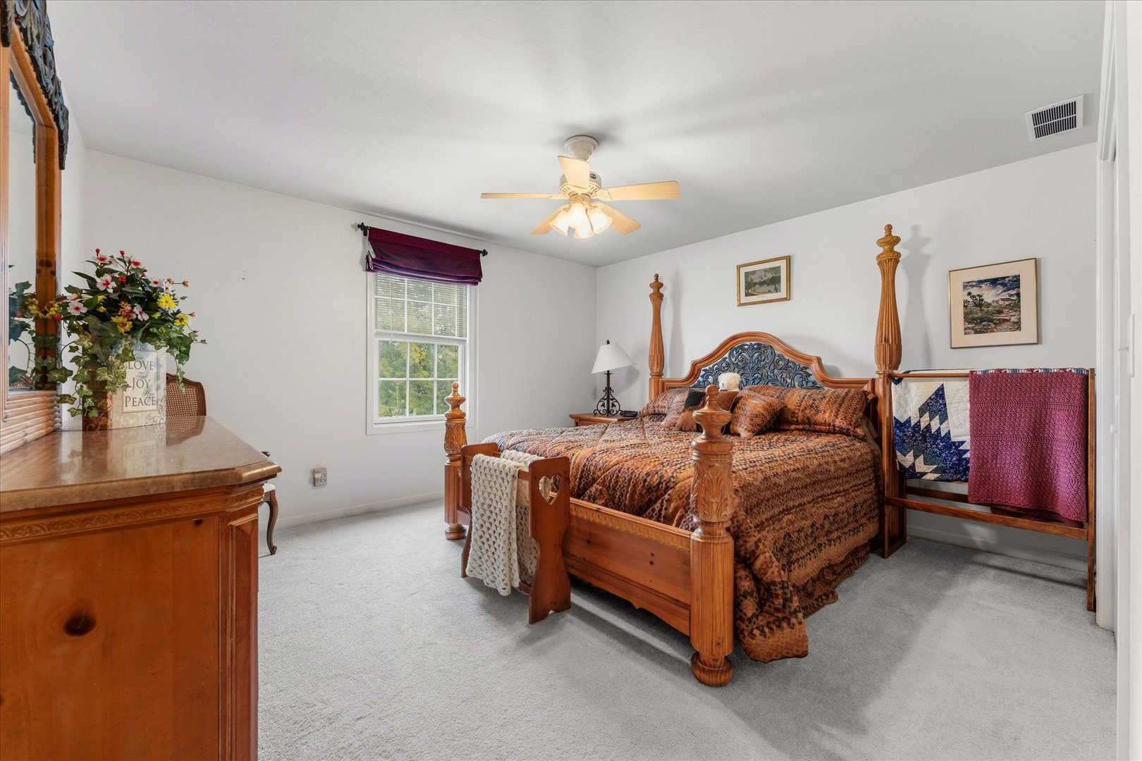 1706 Tin Cup Road, Unit 1706 Mahomet, IL 61853 - Photo 26 of 43 a bedroom with a bed and a chandelier