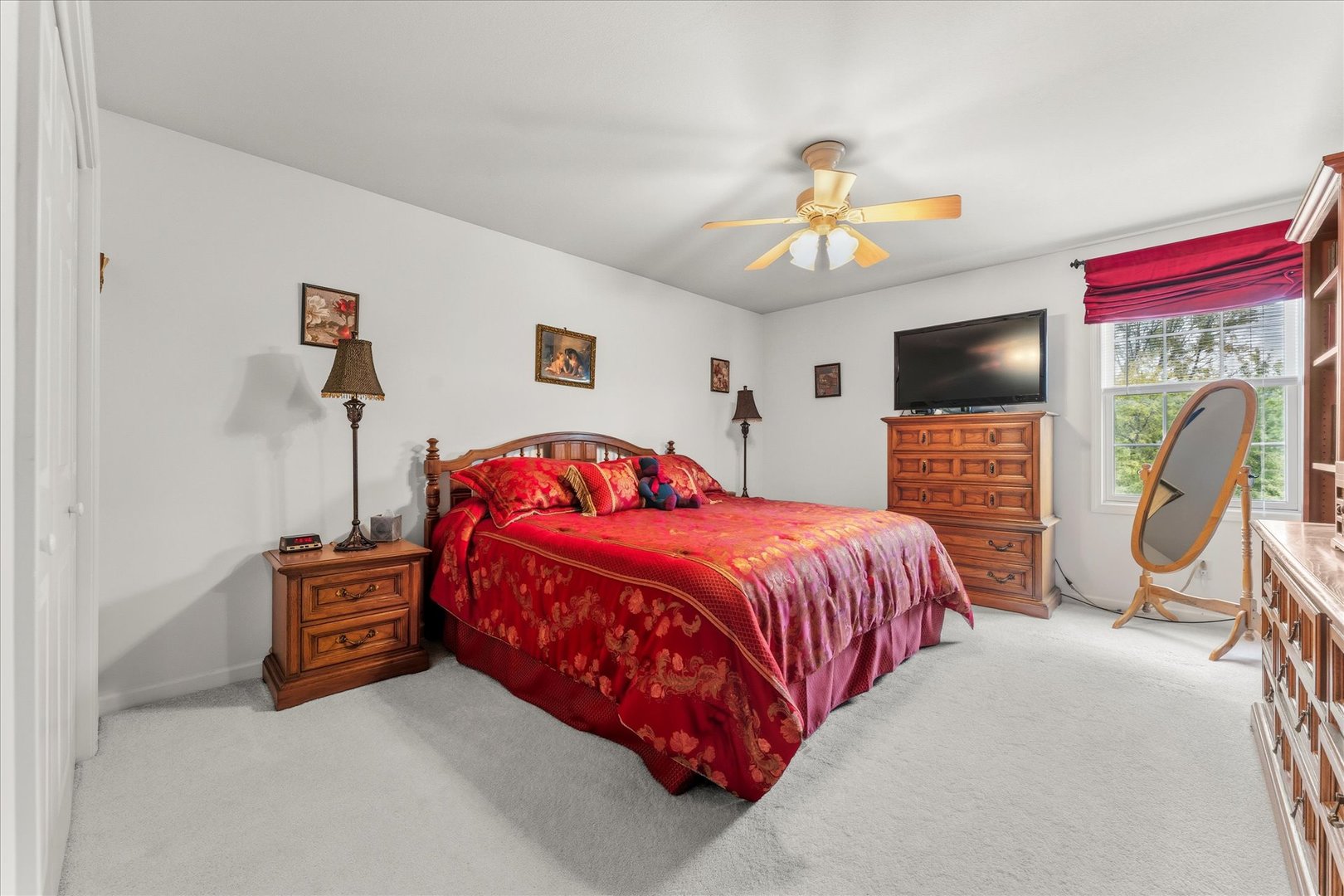 1706 Tin Cup Road, Unit 1706 Mahomet, IL 61853 - Photo 28 of 43 a bedroom with a bed and a chandelier