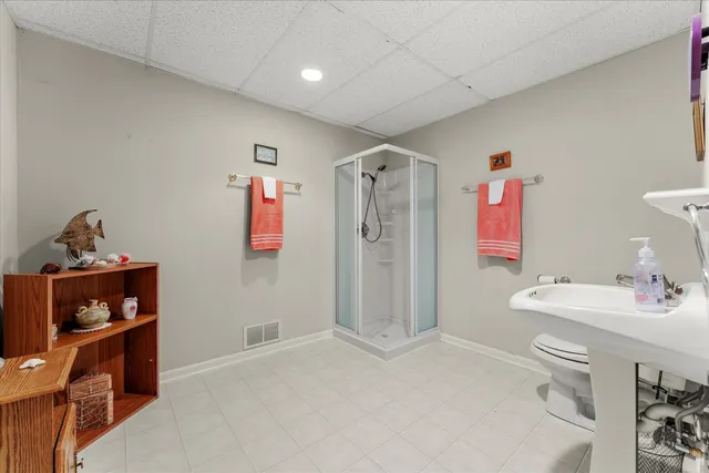 a bathroom with a sink mirror and vanity