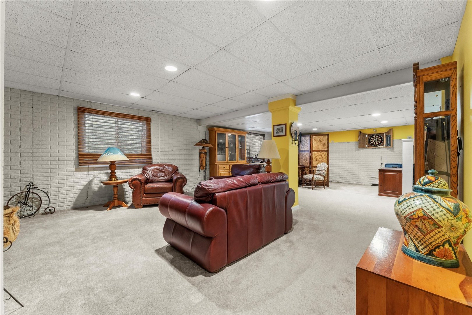 1706 Tin Cup Road, Unit 1706 Mahomet, IL 61853 - Photo 30 of 43 a living room with furniture window and a flat screen tv