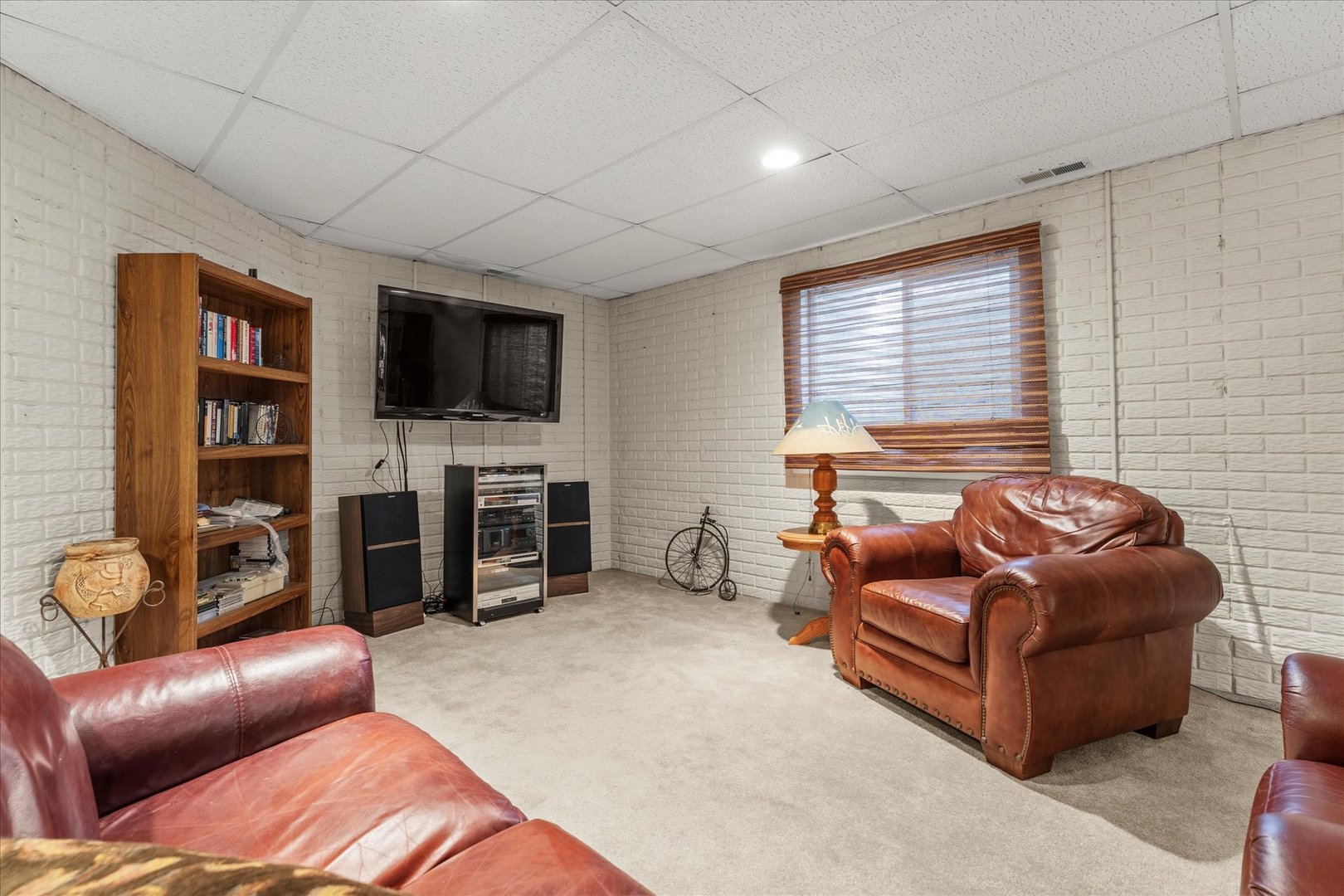 1706 Tin Cup Road, Unit 1706 Mahomet, IL 61853 - Photo 31 of 43 a living room with furniture and a flat screen tv