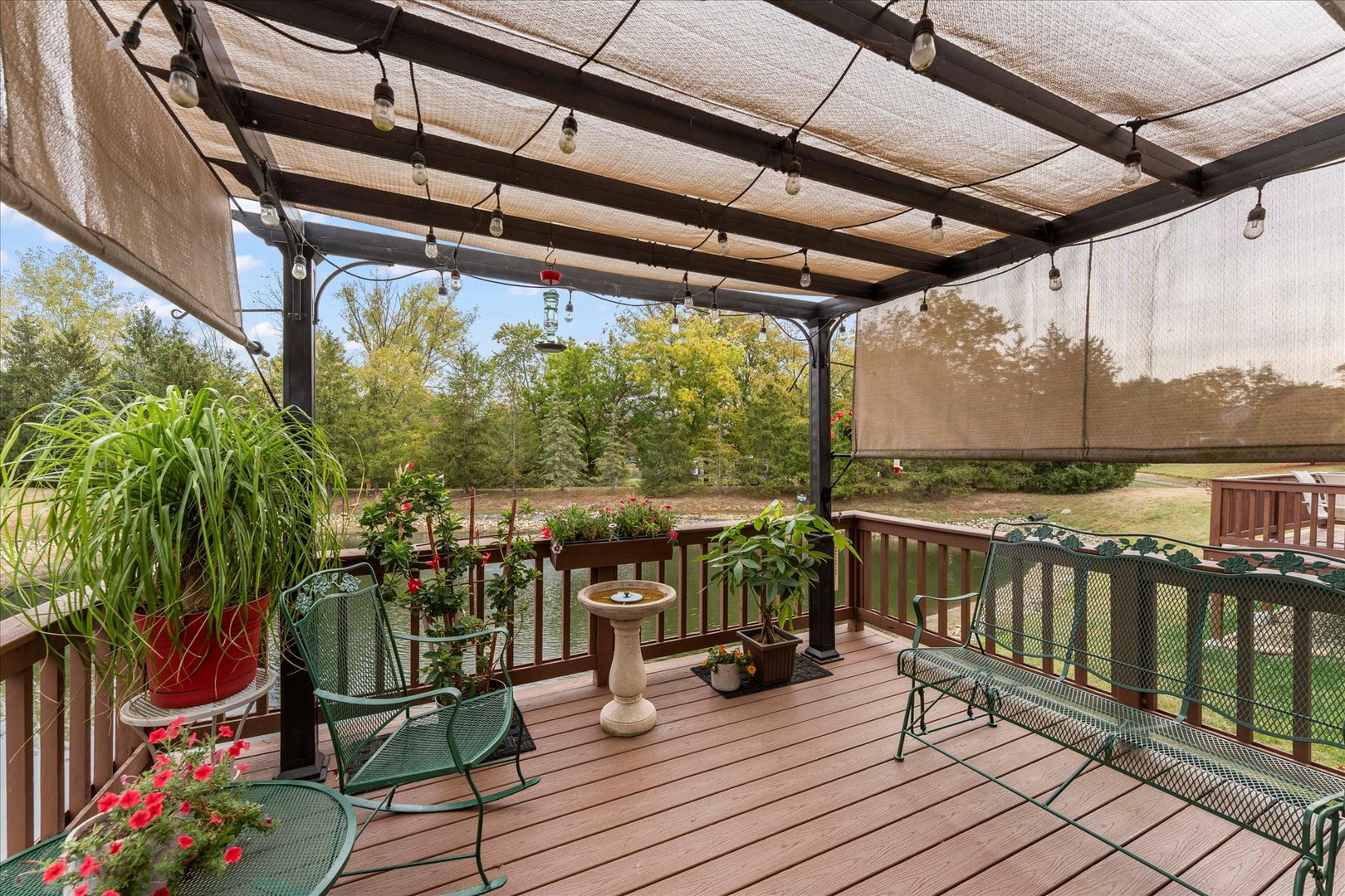 1706 Tin Cup Road, Unit 1706 Mahomet, IL 61853 - Photo 36 of 43 a view of a balcony with chairs and wooden floor