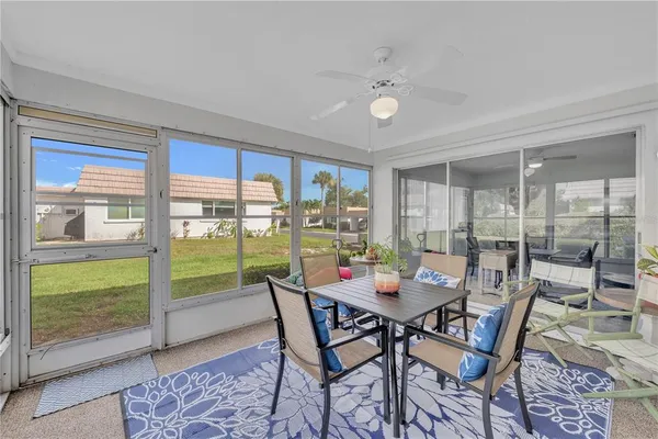a view of a dining room with furniture window and outside view