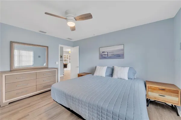 a bedroom with a bed and a dresser