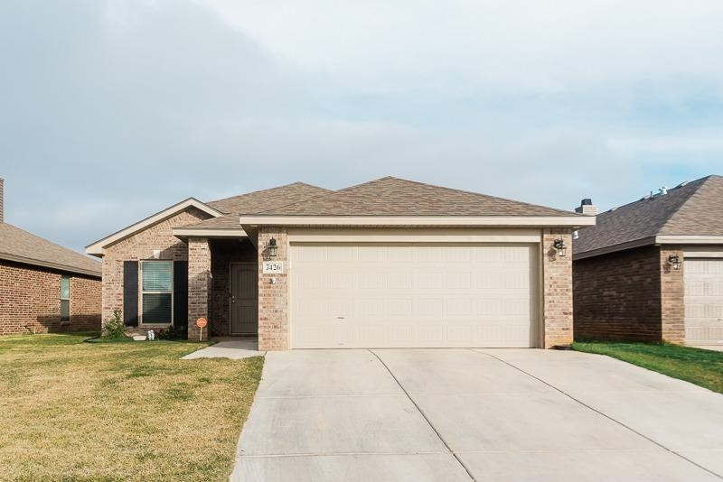 a view of a white house with a outdoor space