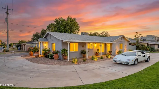 a view of a cars park in front of house