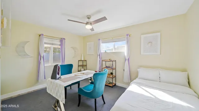 a bedroom with furniture and a window