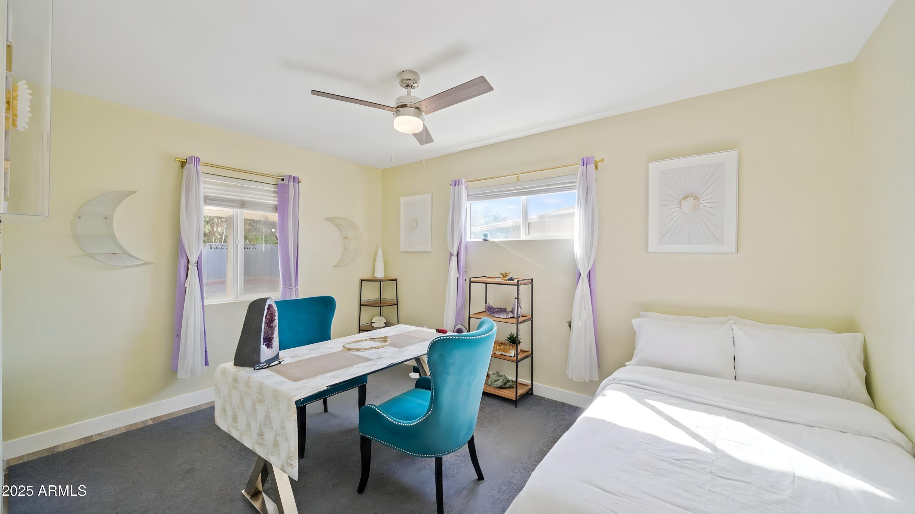 945 East Missouri Avenue Phoenix, AZ 85014 - Photo 12 of 15 a bedroom with furniture and a window