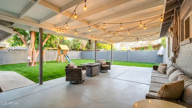 a house view with a sitting space and garden