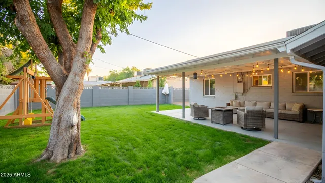 a view of backyard with patio
