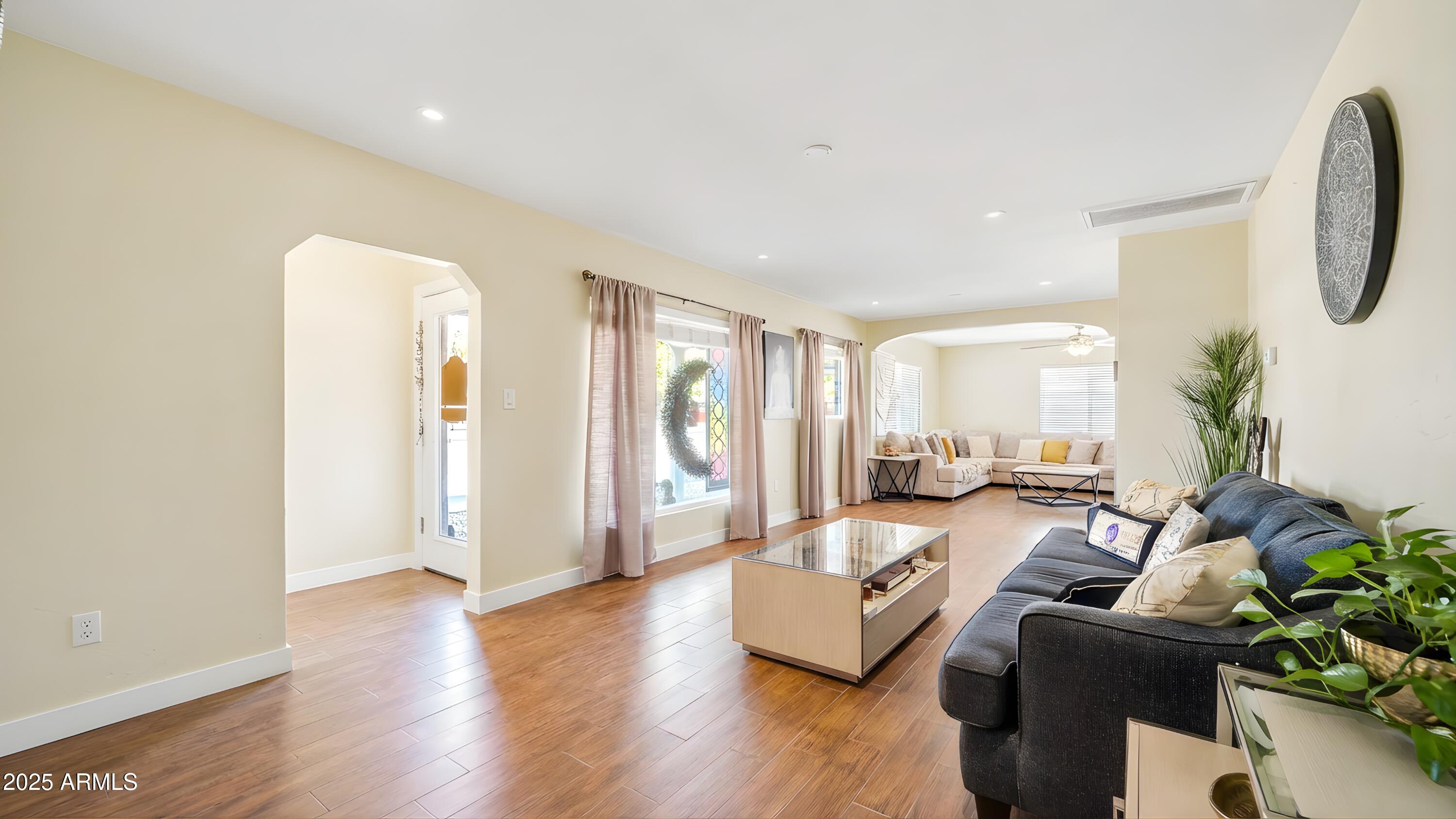 945 East Missouri Avenue Phoenix, AZ 85014 - Photo 4 of 15 a living room with furniture and a large window