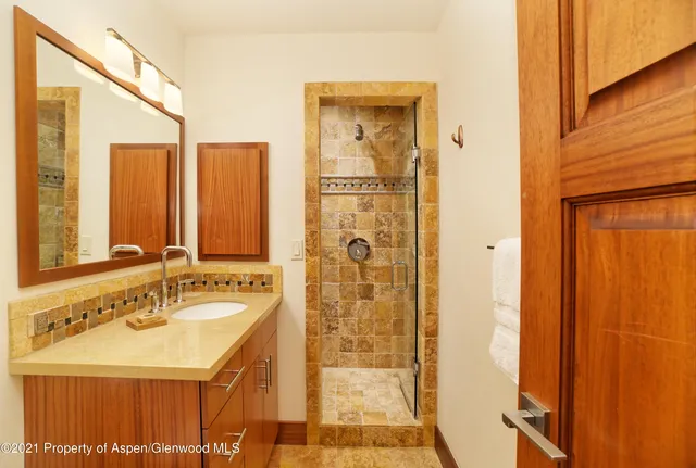 a bathroom with a sink and a mirror