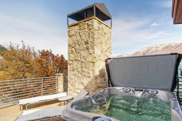swimming pool view with a garden and plants