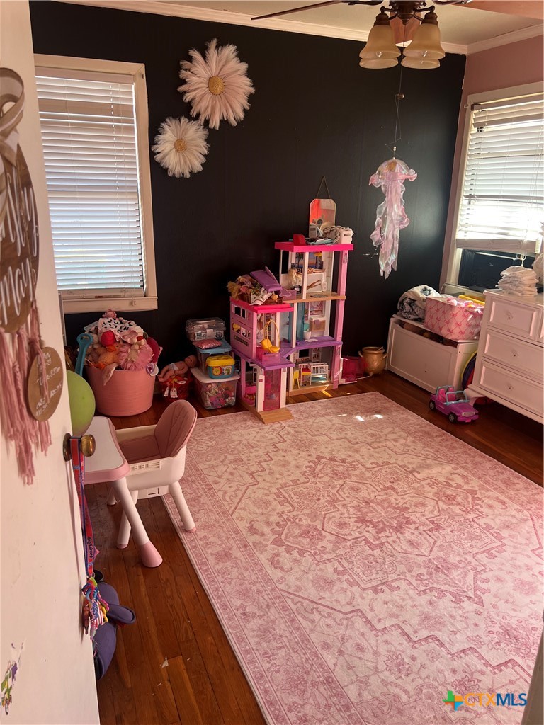2418 Osage Road Gatesville, TX 76528 - Photo 13 of 15 a bedroom with furniture and a chandelier