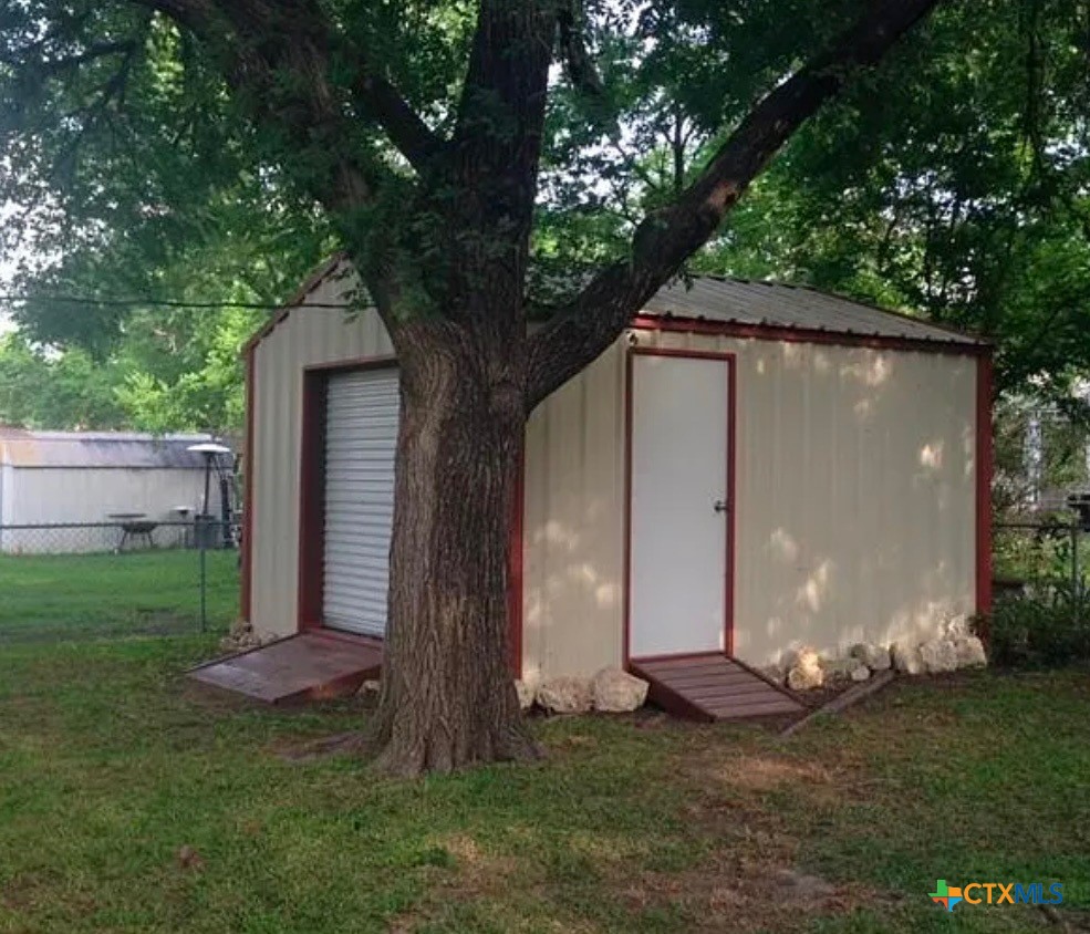 2418 Osage Road Gatesville, TX 76528 - Photo 14 of 15 a backyard of a house with lots of green space