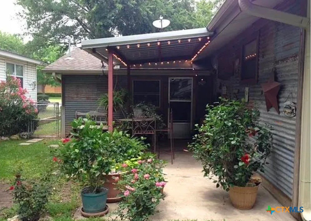 2418 Osage Road Gatesville, TX 76528 - Photo 2 of 15 a view of a house with potted plants