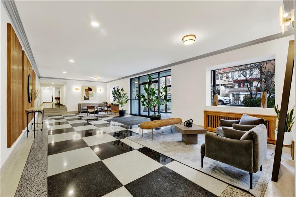 9902 3rd Avenue, Unit 1M Brooklyn, NY 11209 - Photo 17 of 20 a living room with furniture kitchen view and a large window