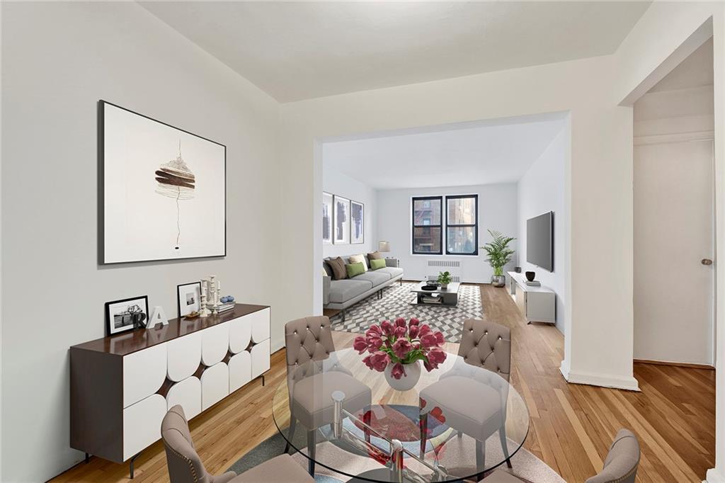 9902 3rd Avenue, Unit 1M Brooklyn, NY 11209 - Photo 3 of 20 a living room with furniture and wooden floor