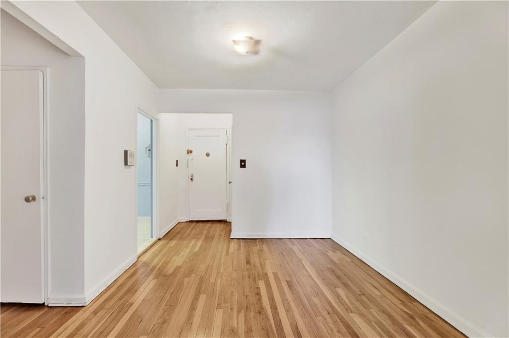 9902 3rd Avenue, Unit 1M Brooklyn, NY 11209 - Photo 8 of 20 a view of a room with wooden floor