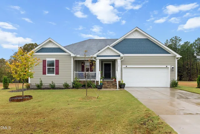 a front view of a house with yard
