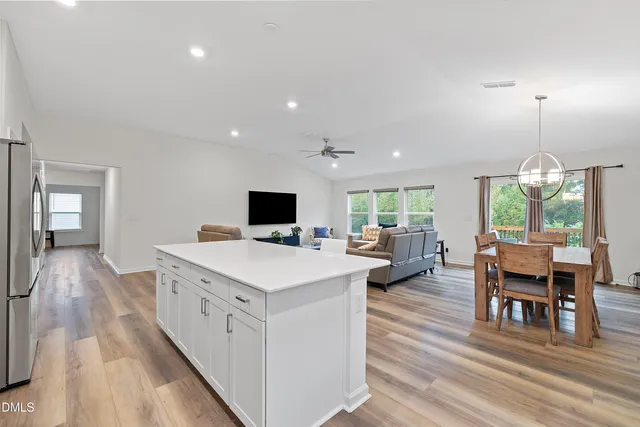 a view of living room with furniture and flat screen tv