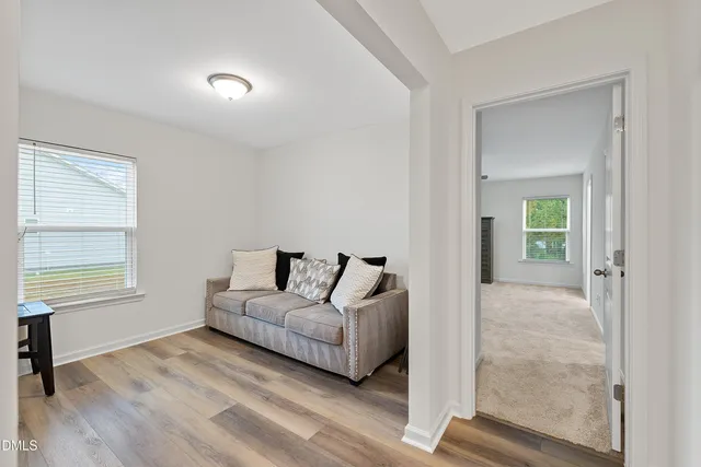 a living room with furniture and a window