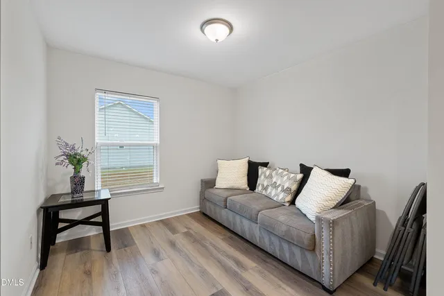 a living room with furniture and a window