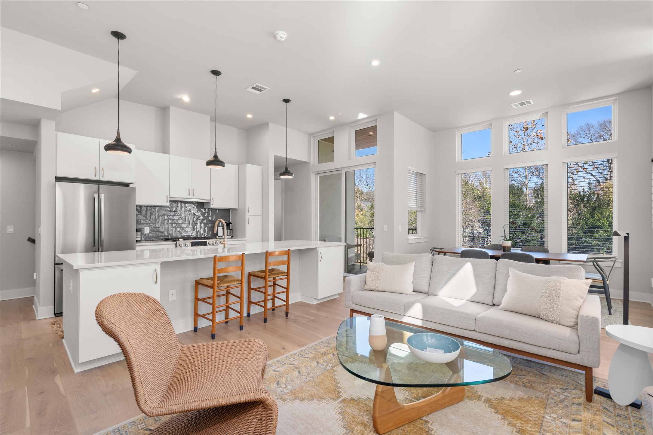 2300 Enfield Road, Unit 204 Austin, TX 78703 - Photo 1 of 1 The main living space on the 2nd level is pure sophistication, featuring an open-concept design with European Oak hardwoods and windows that take up most of the wall space.