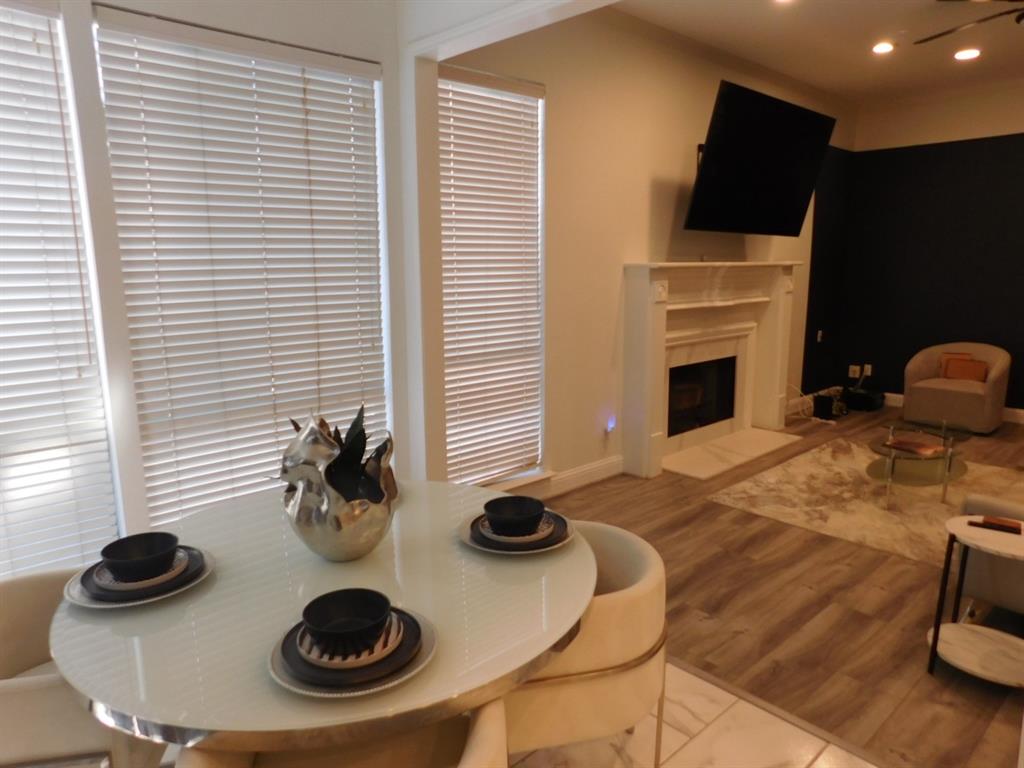 622 Crowley Road Arlington, TX 76012 - Photo 15 of 38 a kitchen with a stove and a wooden floor