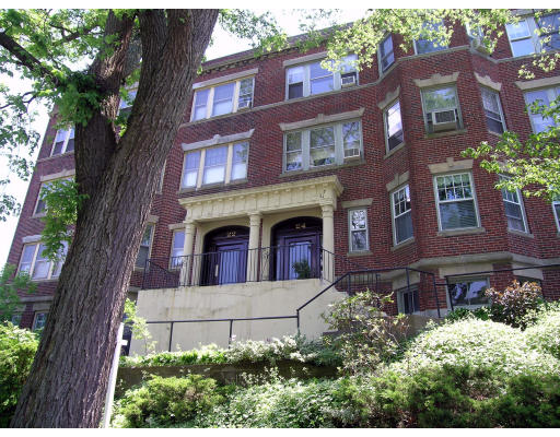 22 Addington Road, Unit 2 Brookline, MA 02445 - Photo 1 of 1 a view of a brick building next to a yard