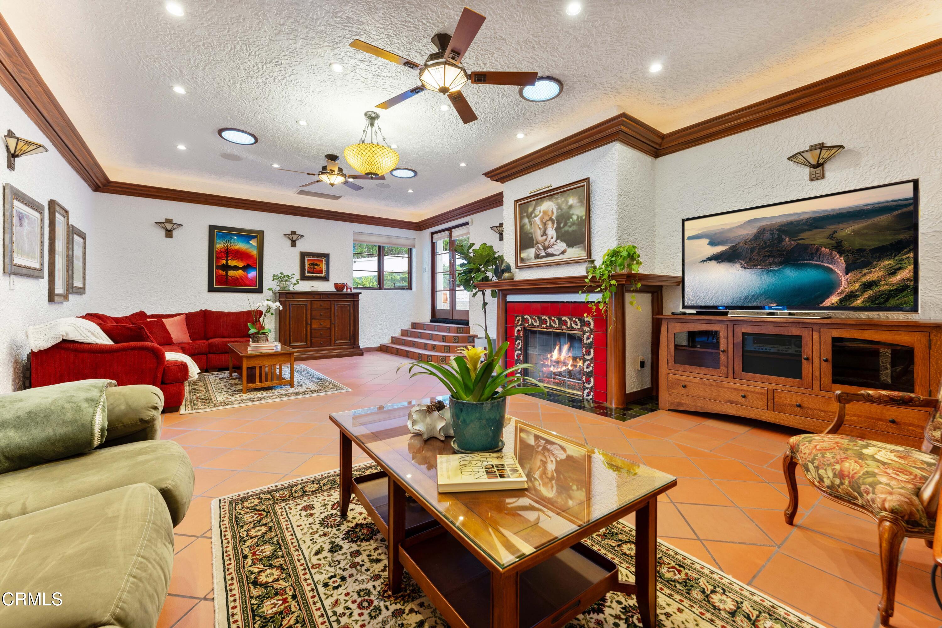 201 La Vereda Road Pasadena, CA 91105 - Photo 4 of 7 a living room with fireplace furniture and a flat screen tv