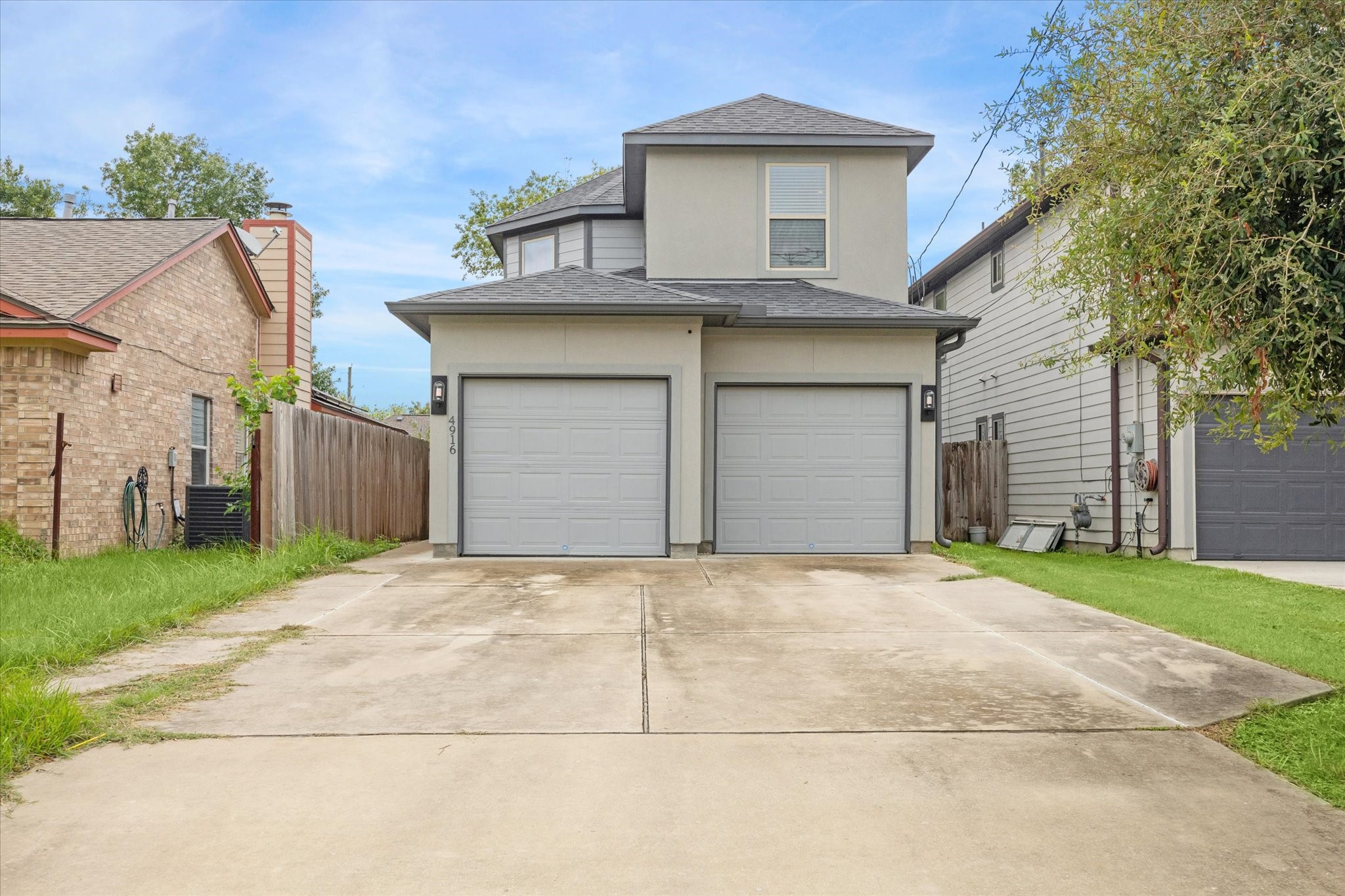 4916 Talina Way Houston, TX 77041 - Photo 1 of 25 front view of a house with a yard and garage