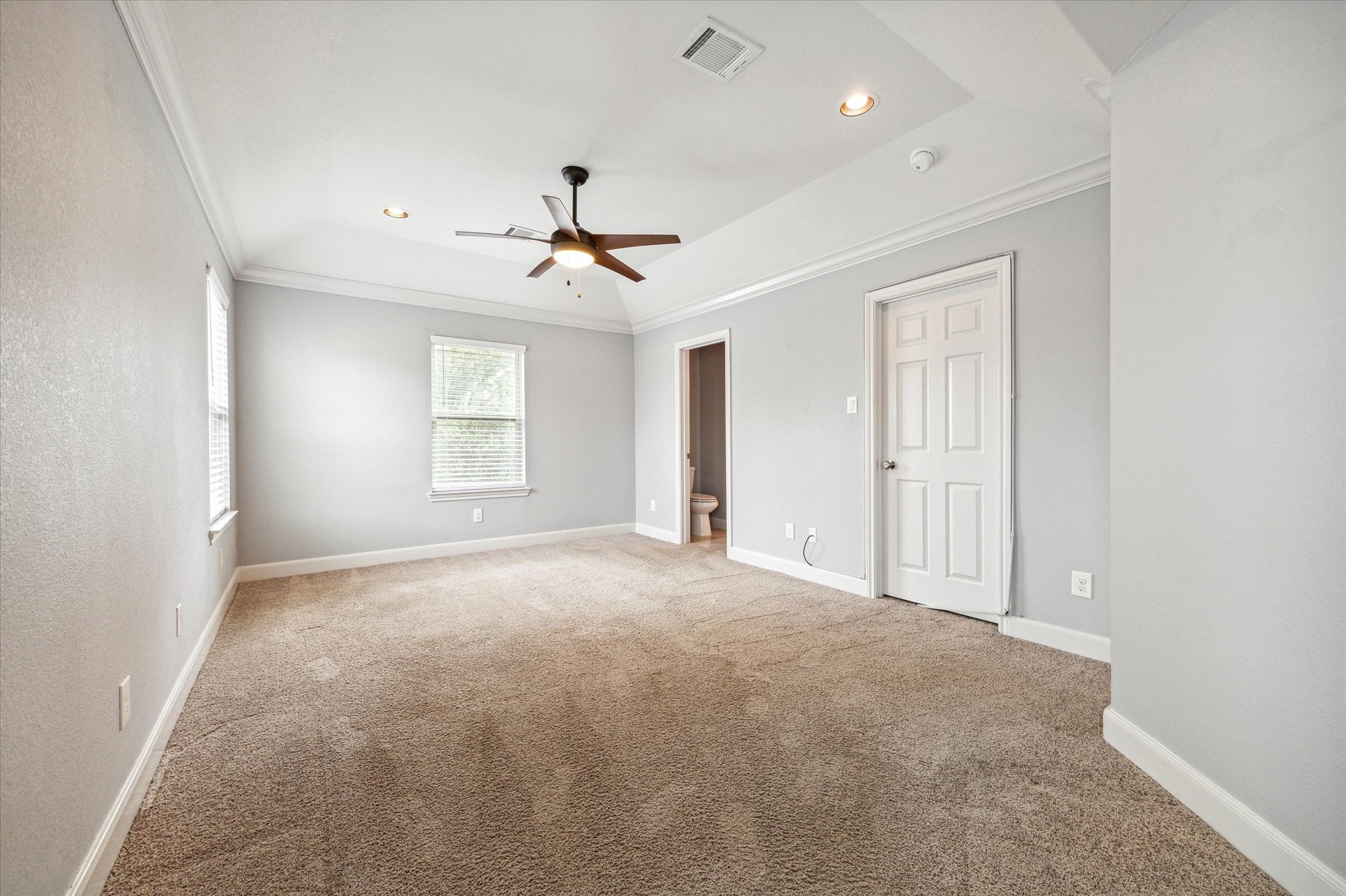 4916 Talina Way Houston, TX 77041 - Photo 12 of 25 a view of a big room with windows and chandelier fan