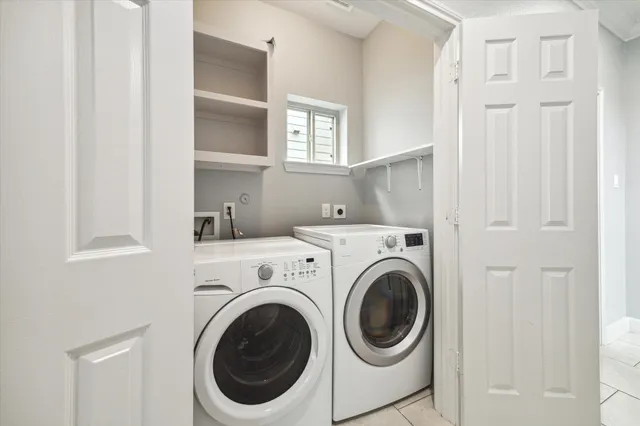 a bathroom with a granite countertop toilet sink and mirror