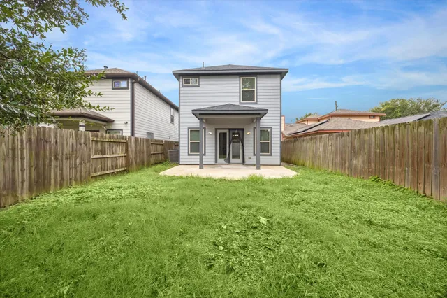 a view of a backyard of the house