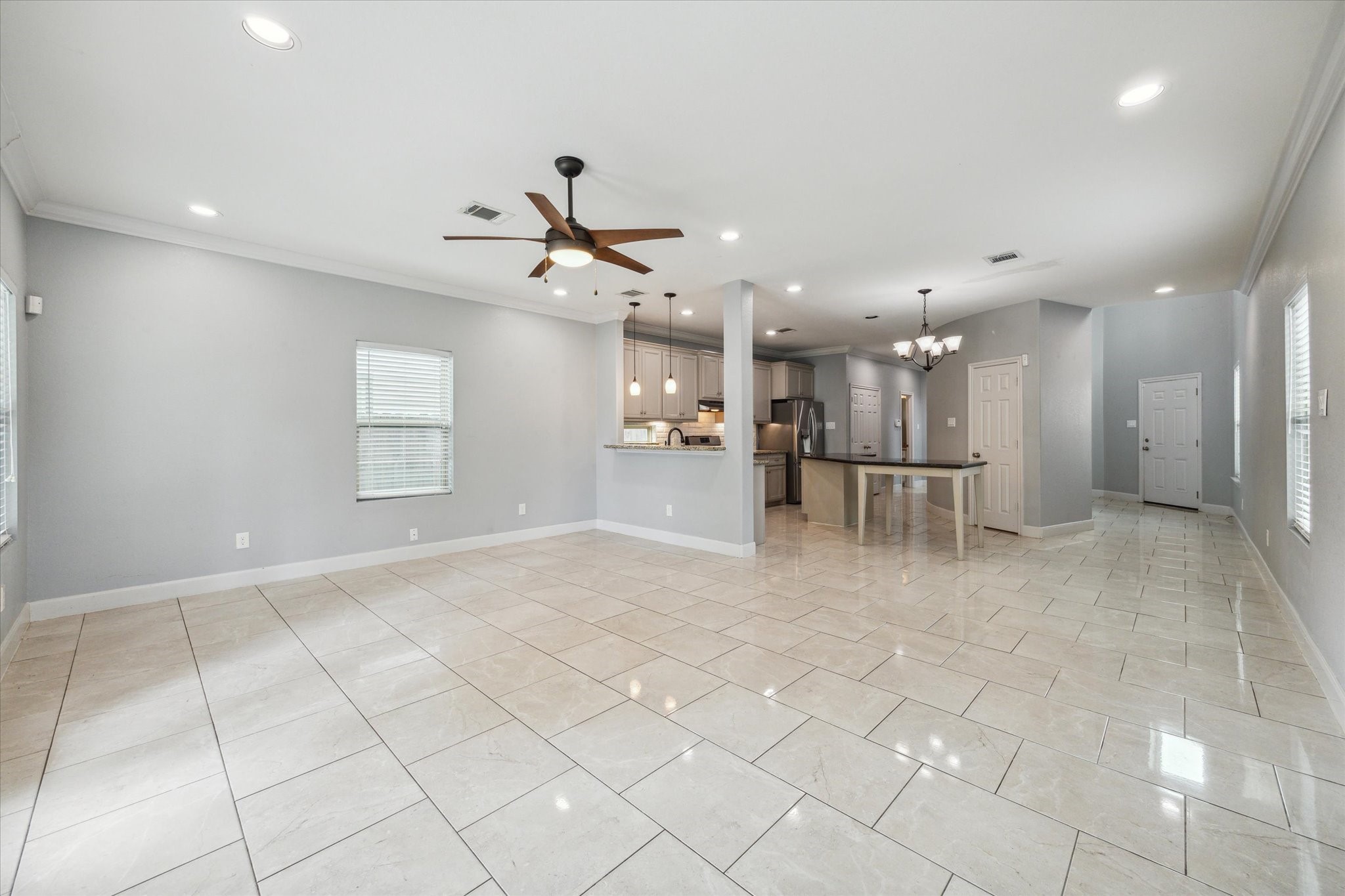 4916 Talina Way Houston, TX 77041 - Photo 22 of 25 a view of a livingroom with furniture and a chandelier