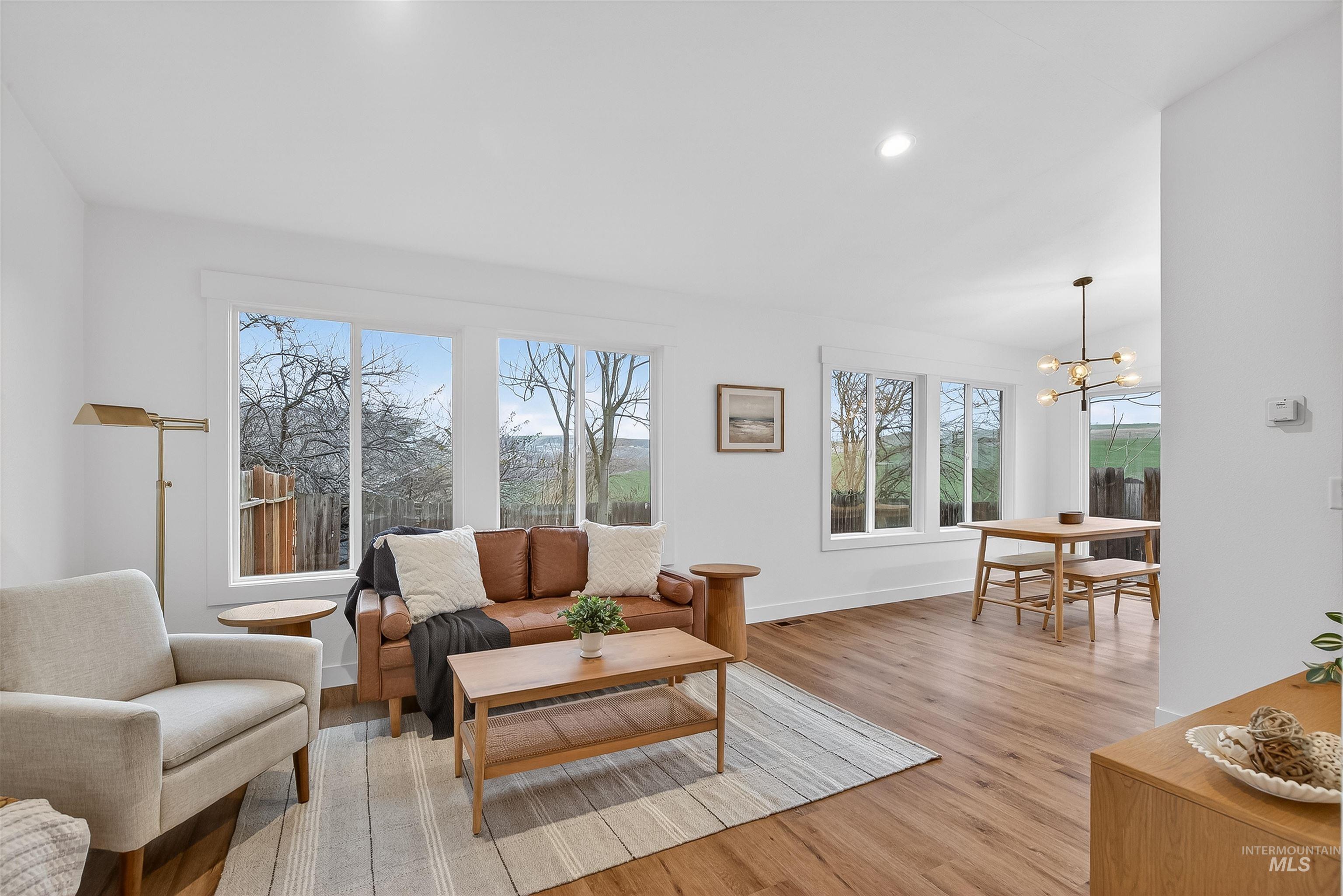 2922 Garfield Court Lewiston, ID 83501 - Photo 12 of 30 Living area with light wood finished floors, a chandelier, and recessed lighting