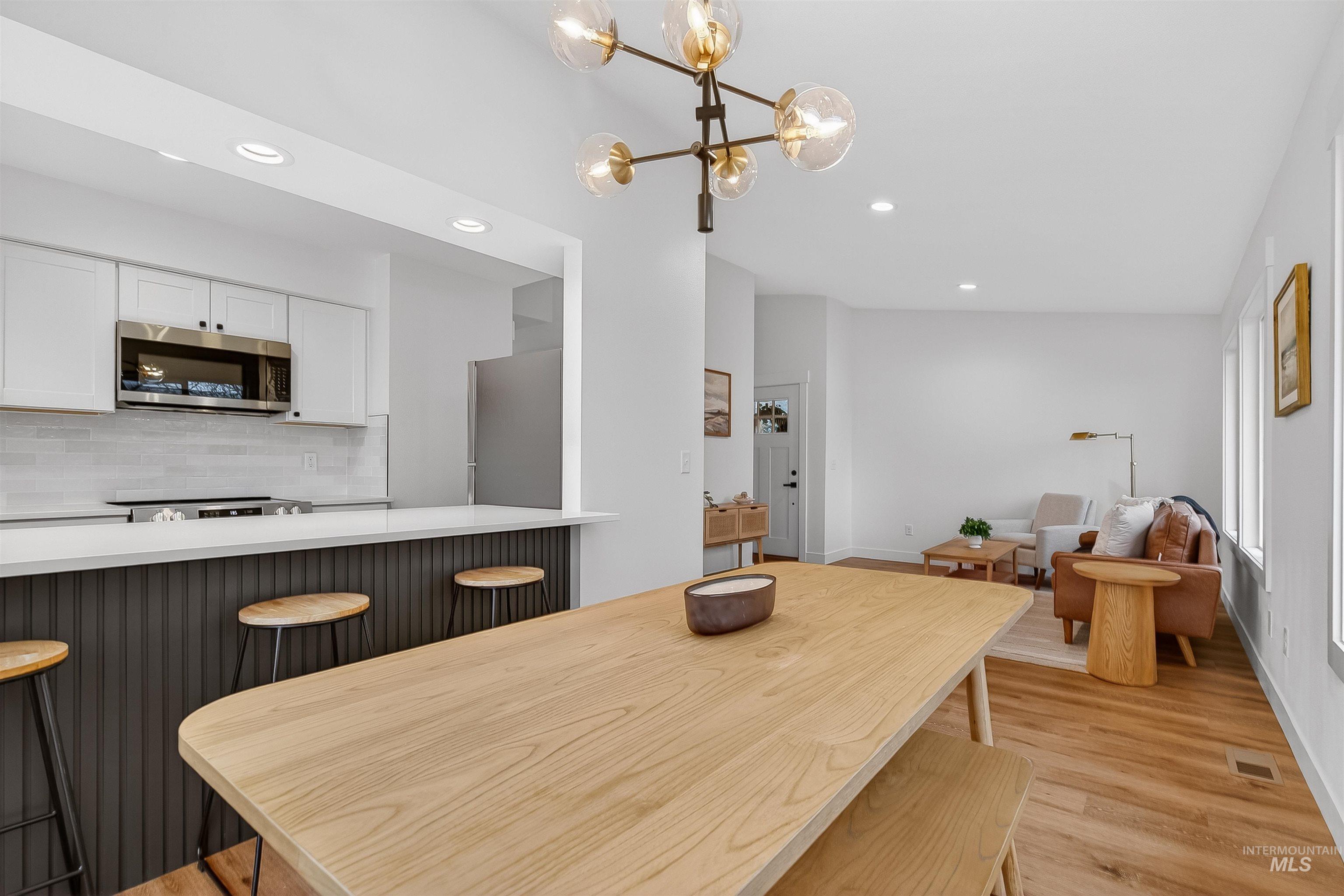 2922 Garfield Court Lewiston, ID 83501 - Photo 10 of 30 Dining area featuring light wood-type flooring, recessed lighting, and a chandelier