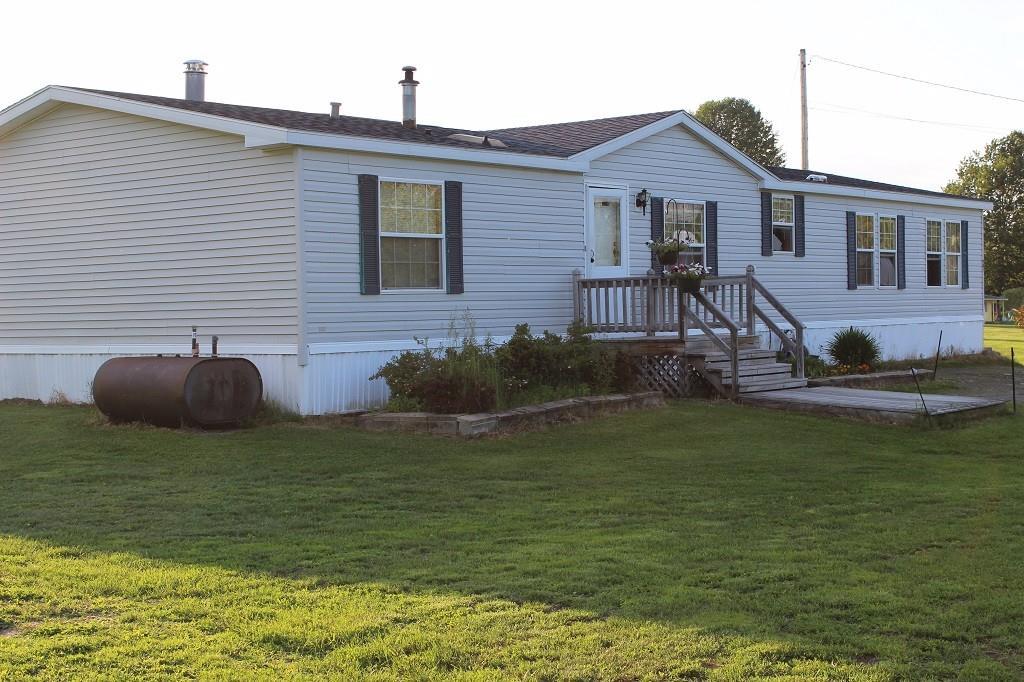 27 Beans Mill Road Corinth, ME 04427 - Photo 30 of 35 Front view of home with evening sun...
