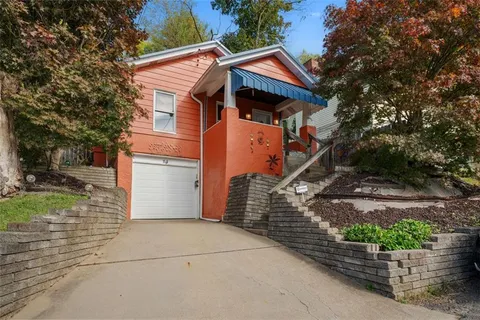 a front view of a house with garage